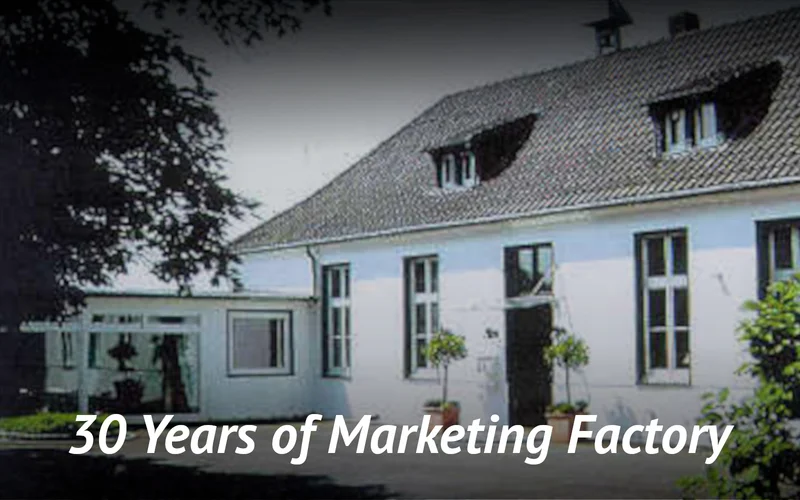 Picture showing dated house exterior greeted with text: "30 Years of Marketing Factory.